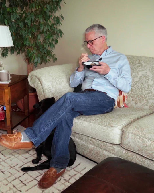 John eating breakfast at home
